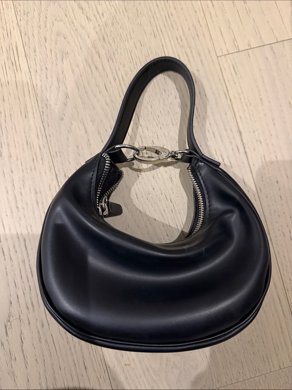 Sleek Black Crescent Hobo Bag with Silver Hardware